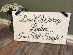 a sign that says don't worry ladies i'm still single