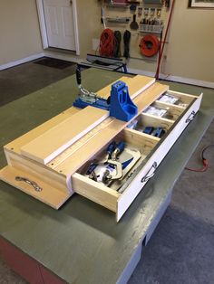 a workbench with tools in the drawer