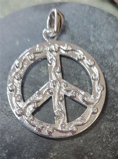 This is a sterling silver peace sign that is just 1 inch around not including the bail. The chain is sold separately. This comes in a jewelry box for gifting. Peace Sign, New Vintage, Pendant Necklaces, 1 Inch, Jewelry Necklace Pendant, Jewelry Box, Berlin, Gift Box, Jewelry Necklaces