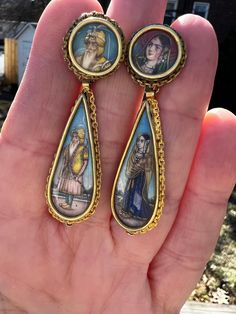 "These fabulous Victorian portrait earrings are set in 18k yellow gold with 14k yellow screw backs. They date from the 1880s and are of Indian original. Possessing entrancing whimsy, this hand painted earrings are beautifully detailed. The fully hand painted earrings have a woman on one earring and the man on the other earring looking like they come from Royalty. They are clad in traditional garb from the period. The tear drop solid gold frame really highlights the enchanting silhouettes. The ea Antique Earrings With Historical Design, Antique Drop Earrings With Historical Design, Antique Earrings With Historical Design For Ceremonial Occasions, Antique Ceremonial Earrings, Antique Earrings With 17 Jewels For Ceremonial Occasions, Victorian Intaglio Earrings For Wedding, Vintage Intaglio Earrings For Wedding, Victorian Portraits, Cameo Earrings