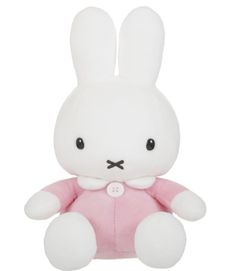 a white stuffed rabbit sitting on top of a white floor next to a pink shirt