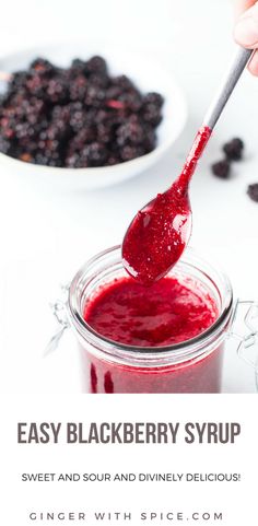 a spoon full of blueberry syrup with the words easy blackberry syrup