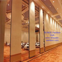 an empty conference room with columns and tables