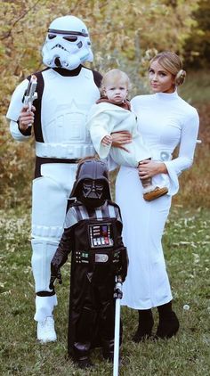 the family is dressed up as stormtrooper and darth vader