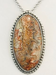 This crazy lace agate is crazy cool! Gorgeous earth tones throughout and this piece was handmade in sterling silver. It weighs 14 grams. Chain not included. Bohemian Silver Jasper Jewelry, Silver Ocean Jasper Bohemian Jewelry, Artisan Silver Jasper Jewelry, Silver Bohemian Ocean Jasper Jewelry, Earthy Sterling Silver Jewelry With Natural Stones, Earthy Sterling Silver Jewelry, Silver Sterling Silver Jewelry, Artisan Agate Necklace Untreated, Artisan Agate Jewelry With Large Stone