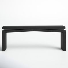 a black bench sitting on top of a white floor