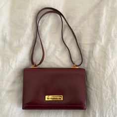 Stunning Early 1970s Leather Hermes Handbag. This Handbag Is In Excellent Condition With Minimal Wear, Mainly From Age. The Leather Is In Excellent Condition. The Color Is A Strong Cognac. The Brass Gold Plated In 18k Latch Is Also In Excellent Condition Doesn’t Look Like It Has Ever Been Used. Minimal Wear. Tiny Superficial Scratch On Back. The Handle Strap Does Not Show Wear But Just A Little Dryness So A Little Cracking.. The Latch Works Perfectly. The Interior Is Very Nice And No Wear Has A Coin Pocket And Two Interior Pockets (Butter Soft On The Inside Of This Bag). This Is A Stunning Purse In Excellent Vintage Condition. The Measurements Are: 10.50" Wide By 6.50" Tall By 2" Wide, No Hermes Handbags, Brass Gold, Hermes Bags, Leather Handbag, Vintage 1970s, Clutch Handbag, Cognac, Leather Handbags, Coin