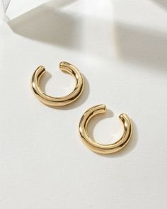 The "Sleek Orbit Ear Cuff Set" is the ultimate find for individuals craving the versatility and edge of multiple piercings with zero commitment. These cuffs are designed for comfort and ease, ensuring a secure fit that complements your look throughout the day. Ideal for achieving a balanced, layered aesthetic, this set delivers on both style and practicality. Elevate your accessory collection with this paired statement. Modern Adjustable Cartilage Earrings For Everyday Wear, Adjustable Open Ring Ear Cuff For Everyday, Adjustable Open Ring Ear Cuff, Adjustable Tarnish Resistant Ear Cuff For Everyday, Multiple Piercings, Outfit Jewelry, Brass Cuff, Capricorn And Aquarius, Druzy Quartz