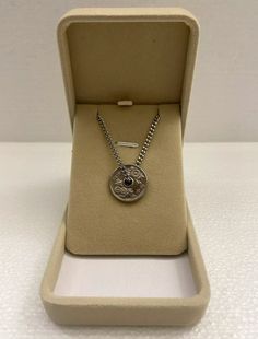 Add a touch of vintage elegance to your jewelry collection with this Japan 50 Yen Coin Stainless Steel Chain Necklace. The necklace features a beautiful silver color and is made of high-quality stainless steel material. The pendant/locket type is a coin and the style is a chain. This necklace is perfect for those who appreciate unique and stunning pieces of jewelry. The vintage necklace comes with a 20-inch inc 3mm stainless steel chain and is kept in a jewelry box. The necklace is made in the U Vintage Stainless Steel Box Chain Jewelry, Metal Chain Necklace With Polished Finish As A Gift, Vintage Stainless Steel Box Chain Necklaces, Vintage Stainless Steel Necklaces With Box Chain, Luxury Silver Chain Necklace With Round Pendant, Antique Silver Chain Necklace For Gift, Vintage Silver Stainless Steel Necklace, Vintage Silver Stainless Steel Necklaces, Vintage Engraved Chain Necklace For Gift