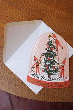 an envelope with a christmas tree on it