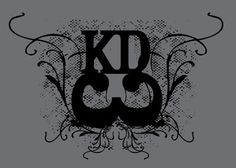 the letter k is surrounded by ornate scrolls and swirls on a gray background with black ink