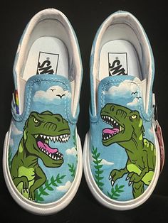 Dinosaur/t-rex themed hand painted kids vans **Please be sure of your size when ordering. No returns, exchanges or refunds as each pair is custom handmade.** **No way affiliated or endorsed with the companies, subsidiaries or affiliates of any of the content I paint on the shoes** Q. What is your turn around time? A. Usually I have many orders at one time so I do ask for UP TO 3 WEEKS to have the time to order the shoes, work on them in order received and drop them off with USPS.  Q. Do you do r Shoe Painting Ideas Vans, Dinosaur Shoes, Custom Sneakers Diy, Custom Shoes Diy, Skater Shoes