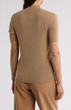 Enjoy the versatility of this short-sleeve sweater knit from soft, lightweight yarns with fine ribbed stitches. 24" length (size Large) Mock neck Short sleeves 83% rayon, 17% nylon Machine wash, tumble dry Imported Elegant Short Sleeve Tops With Ribbed Collar, Classic Short Sleeve Knit Top, Brown Short Sleeve Tops With Ribbed Collar, Classic Beige Fine Knit Top, Beige Turtleneck Top With Ribbed Collar, Classic Brown Turtleneck Top, Brown Knit Top With Ribbed Collar, Classic Short Sleeve Knit Top With Ribbed Collar, Classic Beige Textured Knit Top