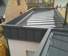 the roof of a house with a metal gutter