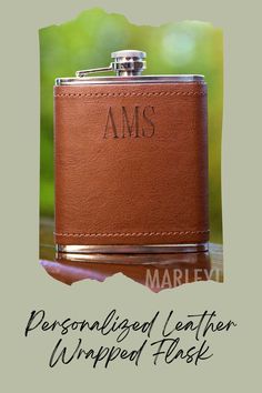 a personalized leather wrapped flask with the word ams written on it in black ink