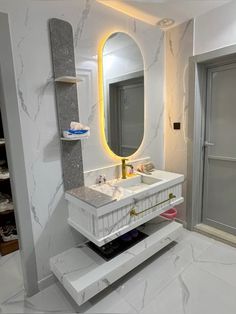 a bathroom with marble counter tops and white walls