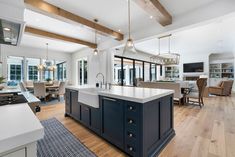 a large kitchen with an island in the middle and lots of counter space around it