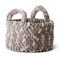 a gray and white basket with handles