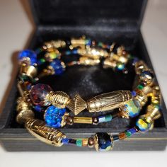 Fashionable Vintage 1800s, Stylish Egyptian Memory Bead 7"- 8" Tri Bracelet, Handmade, Fits To Size, Multi Color. The Bracelet Represents When It Was Stylish To Wear Several Bracelets On Each Arm. Design Sources At The Museum Education Winterthur. Midnight Blue With Gp Frame Pierced Earrings Are Separate Blue Bracelets With Gold Beads For Jewelry Making, Handmade Vintage Blue Beaded Bracelets, Gold Beaded Bracelets With Large Czech Glass Beads, Vintage Blue Beaded Bracelets With Round Beads, Gold Hand-strung Czech Glass Bracelets, Gold Czech Glass Hand-strung Bracelet, Gold Bracelets With Faceted Beads, Unique Gold Beaded Bracelets With Faceted Beads, Adjustable Colorful Beads Bracelets Costume Jewelry