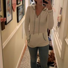 Never Worn Cable Knit Anthropologie Sweater By Sparrow. Size S. Ivory Color With Gray Trim. Pocket In Front And Hood In Back. Cream Cozy Fit Long Sleeve Sweatshirt, Cozy Fit Cream Long Sleeve Top, Cream Long Sleeve Cozy Fit Top, Cream Long Sleeve Top With Cozy Fit, Knit Hoodie Tops, Casual Cozy Fit Winter White Top, Casual Off White Soft Knit Sweater, Beige Long Sleeve Sweater With Drawstring Hood, Casual Cream Sweater With Drawstring Hood