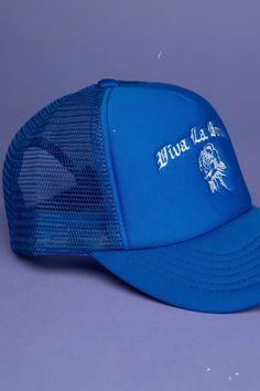 Top off your style with our ROYAL BLUE TRUCKER HAT! Made of luxe nylon, this edgy cap features an embroidered logo, adjustable snapback, and our very own VLB label. Whether you're hitting the gym, the town, or just hangin' out, this statement piece has you covered! Let 'em know who you are and what you stand for. Blue Trucker Style Baseball Cap With Visor, Blue Adjustable Trucker Hat Hip Hop Style, Trendy Blue Trucker Hat For Streetwear, Trendy Blue Snapback Hat For Streetwear, Blue Baseball Cap For Summer Streetwear, Blue Flat Brim Trucker Hat For Streetwear, Blue Trucker Baseball Cap With Visor, Blue Trucker Hat With Embroidered Logo For Summer, Blue Trucker Baseball Cap For Streetwear