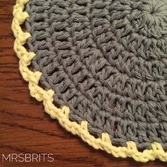 a crocheted doily on a wooden table