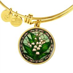 "Embrace the delicate beauty of the Lily of the Valley with our exquisite Personalized 18K Gold Charm Pendant Lily of the Valley Bracelet. This perfect birth flower jewelry gift celebrates the month of May in all its splendor. Crafted with precision and personalized with care, this bracelet serves as a meaningful keepsake for those born in May or anyone who appreciates the enchanting allure of this timeless flower. Adorn yourself or someone special with this elegant and sentimental piece, captur Yellow Gold Flower Jewelry For May Birthstone, Green Birth Flower Round Jewelry, Green Birth Flower Jewelry, Gold Flower-shaped May Birthstone Jewelry, Gold Flower Jewelry For May Birthstone, Green Round Jewelry With Birth Flower, Gold Jewelry With Flower Charm For May Birthstone, Flower Charm Jewelry For May Birthstone, Flower Jewelry With May Birthstone Charm