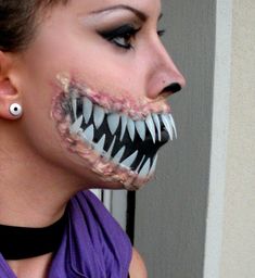 a woman with fake teeth and fangs on her face