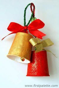 an ornament shaped like a bell with a red ribbon and bow on it