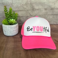 Be You, Your Unique Beautiful Self, And Spread The Positivity With This Cute Trucker Hat! Nwot-Brand New Hat, Never Been Worn. Adjustable/One Size Fits Most. White/Neon Pink. ~Features Six Rows Of Stitching ~Pre-Curved Bill ~Adjustable Plastic Snap Back Closure ~100% Polyester/Foam Front/Mesh Back Height: 4.75" Brim Wide: 6.75" Brim Long: 3" Comfortable, Breathable, Perfect For The Heat Wave! Bring A Smile To Everyone You Pass By While Wearing This Fun, Eye Catching Trucker Hat! White Trucker Hat With Letter Print Visor, Fun White Visor Hat, White Snapback Hat With Letter Print And Short Brim, Trendy White Trucker Hat With Letter Print, Cute White Adjustable Snapback Hat, Cute Adjustable White Snapback Hat, Trendy White Trucker Hat With Short Brim, White Hat With Letter Print, One Size, White Hats With Letter Print For Spring