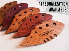 four wooden musical instruments with names engraved on them and the words, personalization available