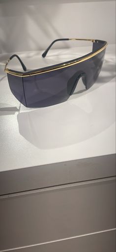 a pair of sunglasses sitting on top of a table