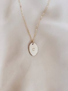 Custom Personalized Oval Initial Necklace. Makes a great gift with your fave initials! Is hand stamp with personalizing your choice letter name. Details: ~ Material: 14K gold filled, 14K rose gold filled or sterling silver ~ Mesure Oval : 11x16mm ** write your favorite letter in “NOTE FOR THE SELLER” this appears in a rectangle box in your cart ** Personalized Dainty Oval Pendant Jewelry, Dainty Personalized Oval Pendant Jewelry, Personalized Oval Gold Necklaces, Dainty Personalized Oval Pendant Necklace, Personalized Gold Oval Necklace, Personalized Oval Gold Necklace, Oval 14k Gold-filled Jewelry For Anniversary, Personalized Oval 14k Gold Jewelry, Personalized Oval Gold Jewelry