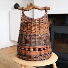 a basket sitting on top of a wooden stool