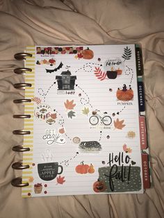 an open notebook with fall stickers on it