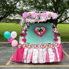 a car decorated with pink and blue decorations