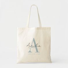 a tote bag with the letter a in green and white on it's front