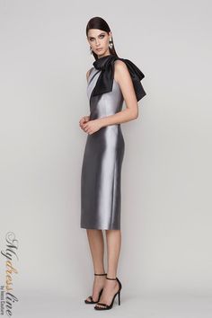 Looking for a sleek and sophisticated sleeveless dress? Check out the Frascara 4112. This stunning dress features a draped bodice with a bow at the shoulder, and a sheath skirt silhouette with a back vent. It's made from 51% silk and 49% wool, and it's satin-lined for a luxurious feel. Plus, it has a hidden back zipper for easy on and off. Party Evening Dress With Detachable Bow And Fitted Bodice, Gala Evening Dress With Detachable Bow And Fitted Bodice, Fitted Bodice Evening Dress With Detachable Bow For Party, Party Evening Dress With Satin Bow And Fitted Bodice, Glamorous Gala Dress With Satin Bow, Sleeveless Dress With Detachable Bow For Gala, Elegant Silk Evening Dress For Gala, Elegant Sleeveless Evening Dress For Gala, Chic Evening Dress With Tie Back For Gala