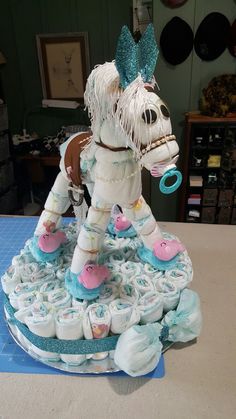 a cake made to look like a horse with boots on it's legs and feet