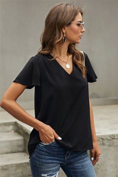 V-neck, high/low hem and flutter sleeves Fits true to size Model is wearing a size small Fabric content: 95% Polyester, 5% Spandex By Shewin Flutter Sleeve Blouse, Casual Black, V Neck Blouse, Daily Look, Basic Style, Short Sleeve Blouse, Black Blouse, Flutter Sleeve, Black Tee