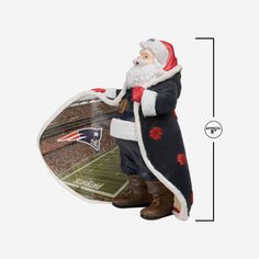 a christmas ornament with a santa clause holding a football