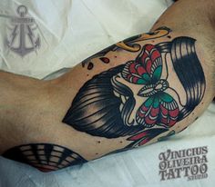 a man with a tattoo on his arm laying down