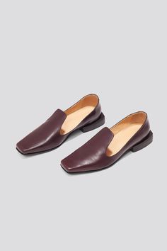 The Olympia Loafer is a babouche-inspired loafer featuring a square boxy toe, a cut-away upper, and a stacked leather heel. Olympia sets itself apart from the typical loafer thanks to its elegant lines. Style the Olympia loafer with suiting for a modern work look or with slip dresses for an elevated, relaxed evening look. Who it’s for: The woman who loves loafers and is looking for a fresh new shape to experiment with. Handmade in Argentina Kidskin leather upper with vegetable tanned leather lin Womens Loafers, Buckled Flats, Slip Dresses, Work Looks, Style Expert, Vegetable Tanned Leather, Beautiful Shoes, Loafers For Women, Olympia