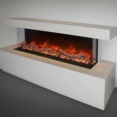 an electric fireplace with flames in the center and white walls, along with grey flooring