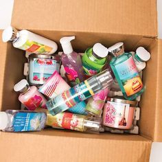 a cardboard box filled with lots of different types of hand soaps and lotions