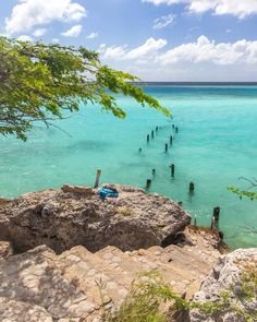 the water is crystal blue and clear with rocks