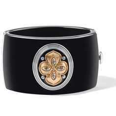 Inspired by Neoclassical architecture, this cuff embodies the beauty and style this type of architecture is known for. Center gold brushed ornaments with fine texture stand out wonderfully on a matte black background. - Width: 1 11/16" - Closure: Hinged - Diameter: 2 1/2" - Material: Fine quality crystals, Resin - Finish: Two Tone We have a double coating of lacquer finish on all of our jewelry items so all you need is just a few tips to keep your jewelry looking good from season to season. - To Elegant Black Enamel Bangle Cuff Bracelet, Elegant Black Enamel Cuff Bracelet Bangle Style, Elegant Black Enamel Cuff Bracelet, Designer Black Cuff Bracelet For Formal Occasions, Elegant Cuff Bangle For Formal Occasions, Elegant Black Cuff Bracelets, Black Chic Cuff Bracelet For Formal Occasions, Black Cuff Bracelet For Formal Occasions, Elegant Formal Cuff Bangle