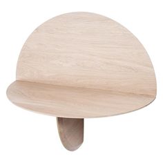 a wooden table with a curved shelf on it