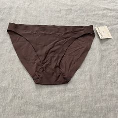 New With Original Tags Size Medium Brown Seamless, Except 2 Seams On Sides Of Waistband Bikini Style Calvin Klein Perfectly Fit Naked Style 80% Nylon / 20% Elastane Calvin Klein Seamless Loungewear Bottoms, Calvin Klein Briefs For Loungewear, Calvin Klein Brief Bottoms For Loungewear, Fitted Seamless Calvin Klein Bottoms, Calvin Klein Seamless Micro-elastic Bottoms, Calvin Klein Seamless Swimwear For Summer, Calvin Klein Seamless Solid Bottoms, Calvin Klein Seamless Swimwear For Beach, Calvin Klein Stretch Bottoms For Beach