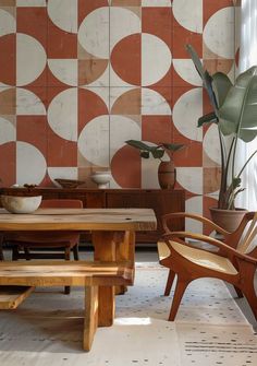 a wooden table sitting next to a potted plant